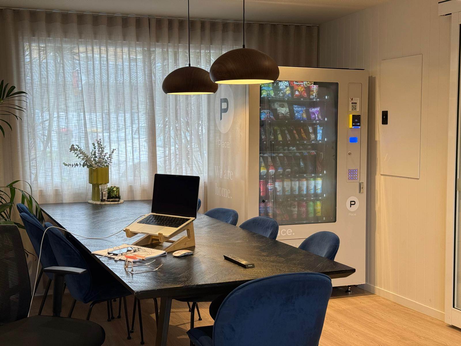Custom branded Place. vending machine in modern office meeting room